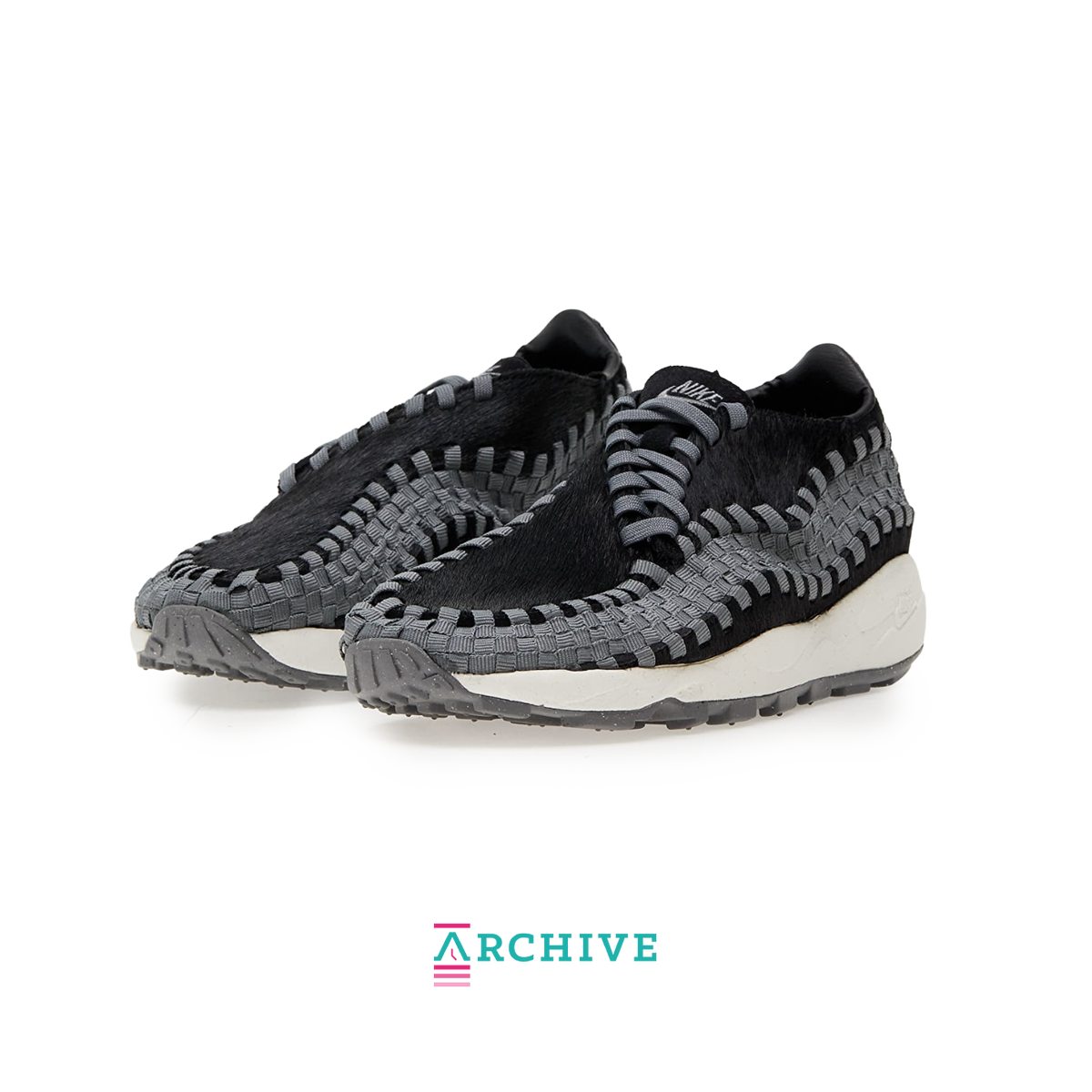 Nike Air Footscape Woven Black sneaker with woven side panels and asymmetrical lacing system
