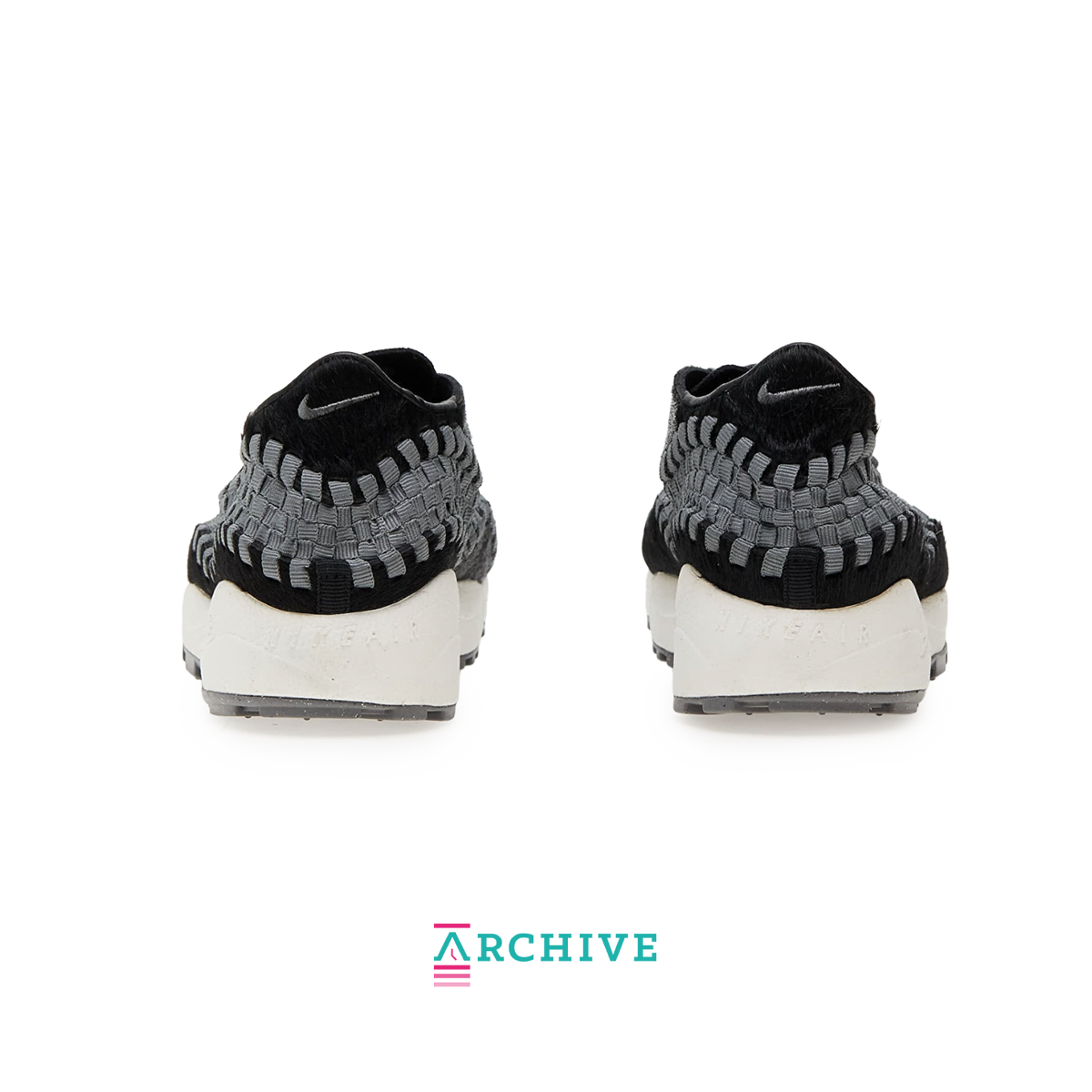 Nike Air Footscape Woven Black sneaker with woven side panels and asymmetrical lacing system