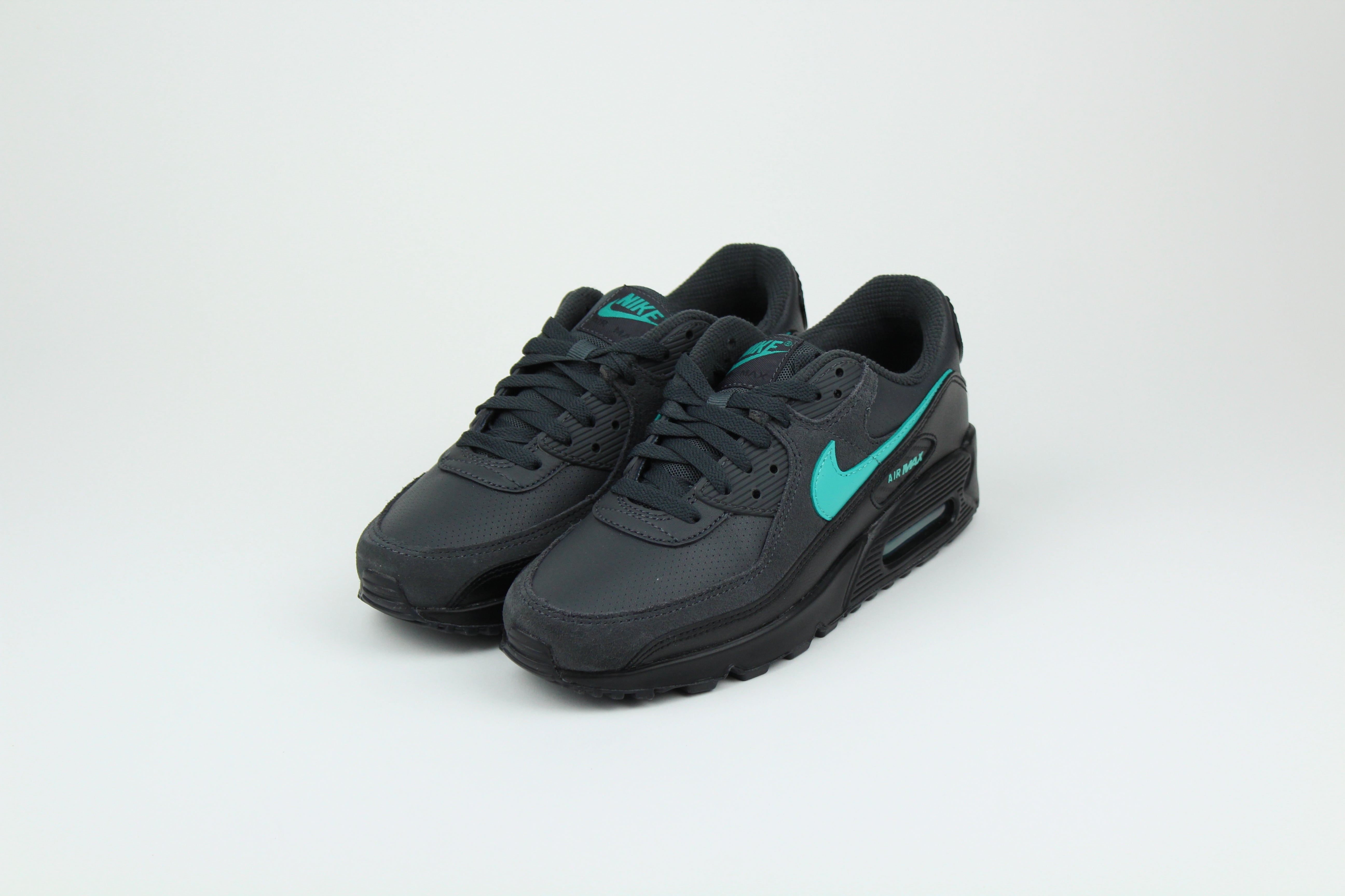 Nike Air Max 90 sneakers in 'Black Tiffany' colorway, bold black and Tiffany blue athletic shoes, perfect for casual and sporty styles.