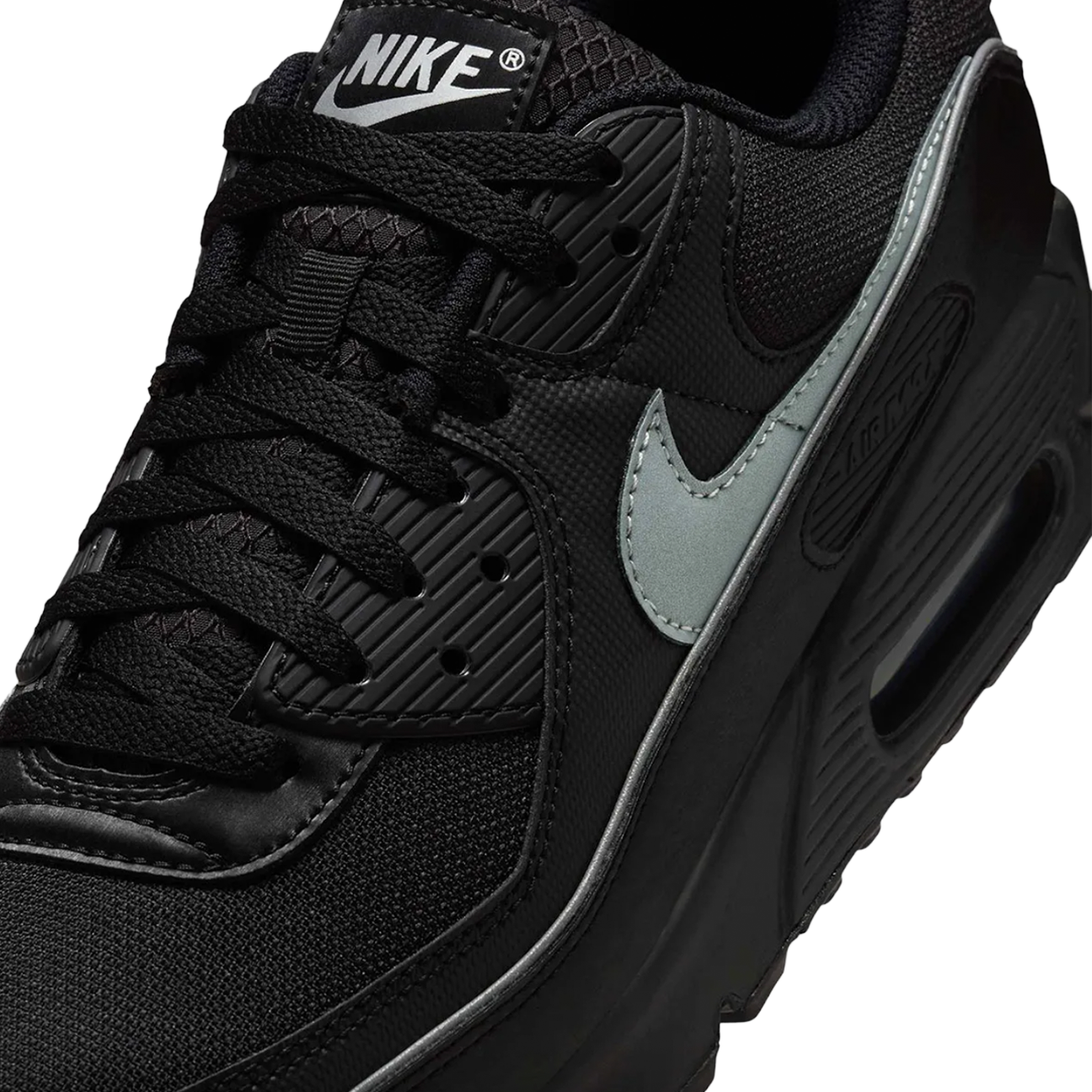 Nike Air Max 90 Premium Black Reflective sneaker with black upper reflective details and classic Air Max cushioning available at The Attic