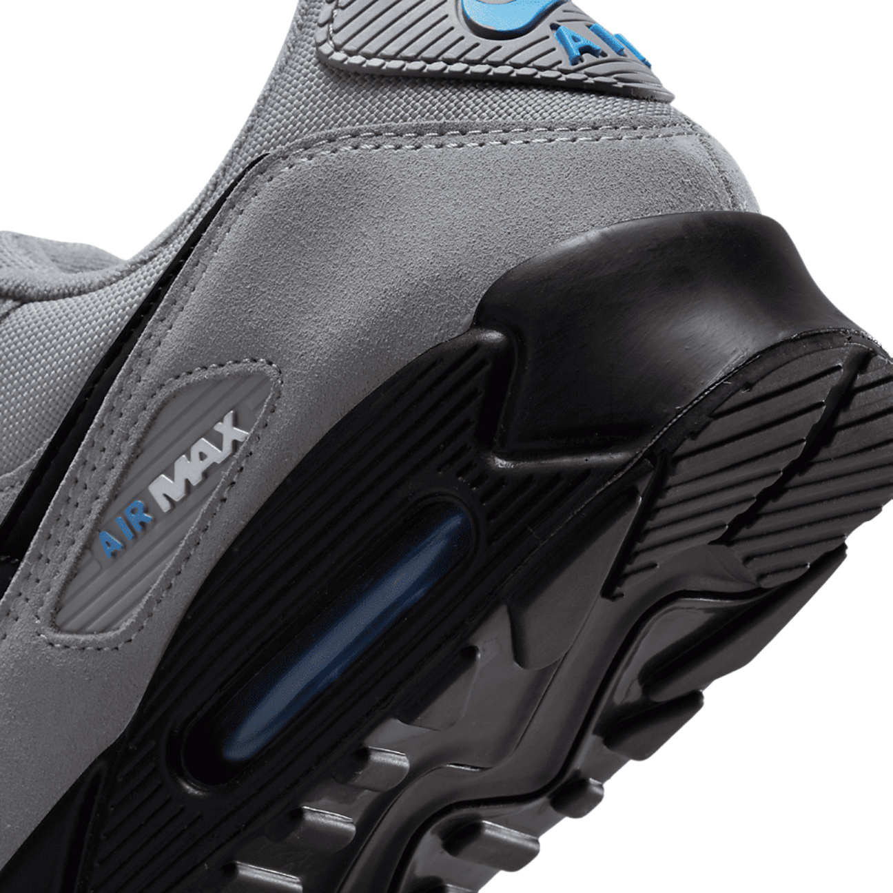 Nike Air Max 90 Smoke Grey Light Photo Blue sneaker with mesh and leather upper blue accents and classic Air Max cushioning available at The Attic