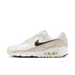 Nike Air Max 90 (Women's) sneakers in 'White & Flat Pewter' colorway, stylish and comfortable women's athletic shoes with white and pewter accents, perfect for casual and sporty wear.