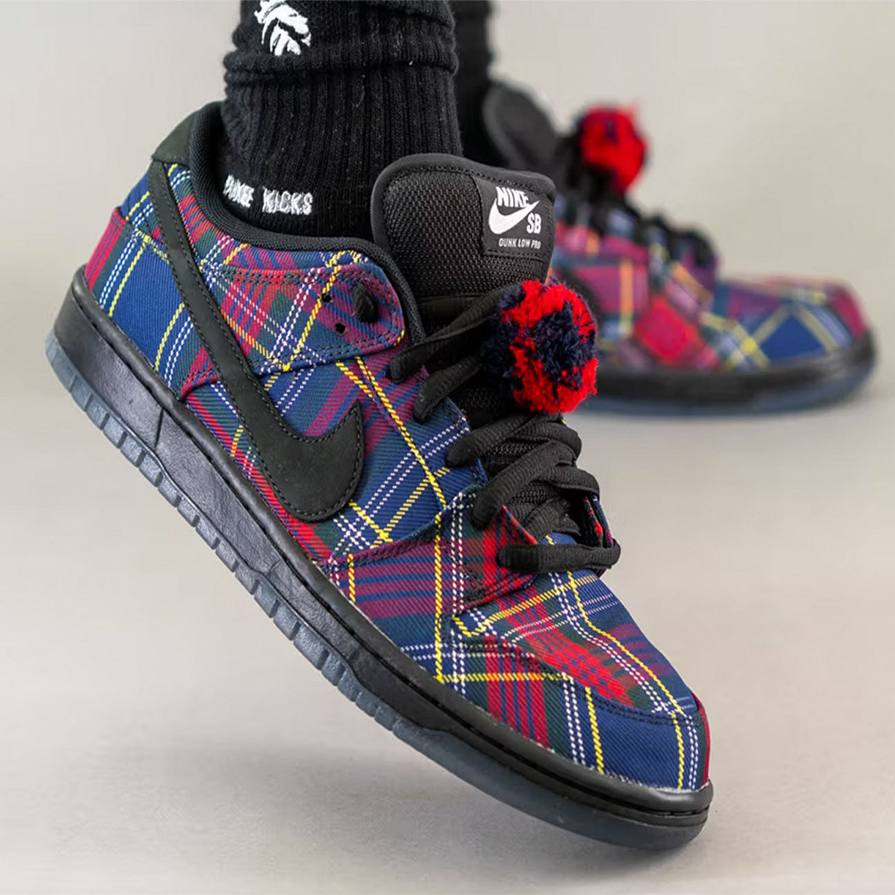 Nike SB Dunk Low Nardwuar sneaker with suede and leather upper tartan details and Zoom Air cushioning