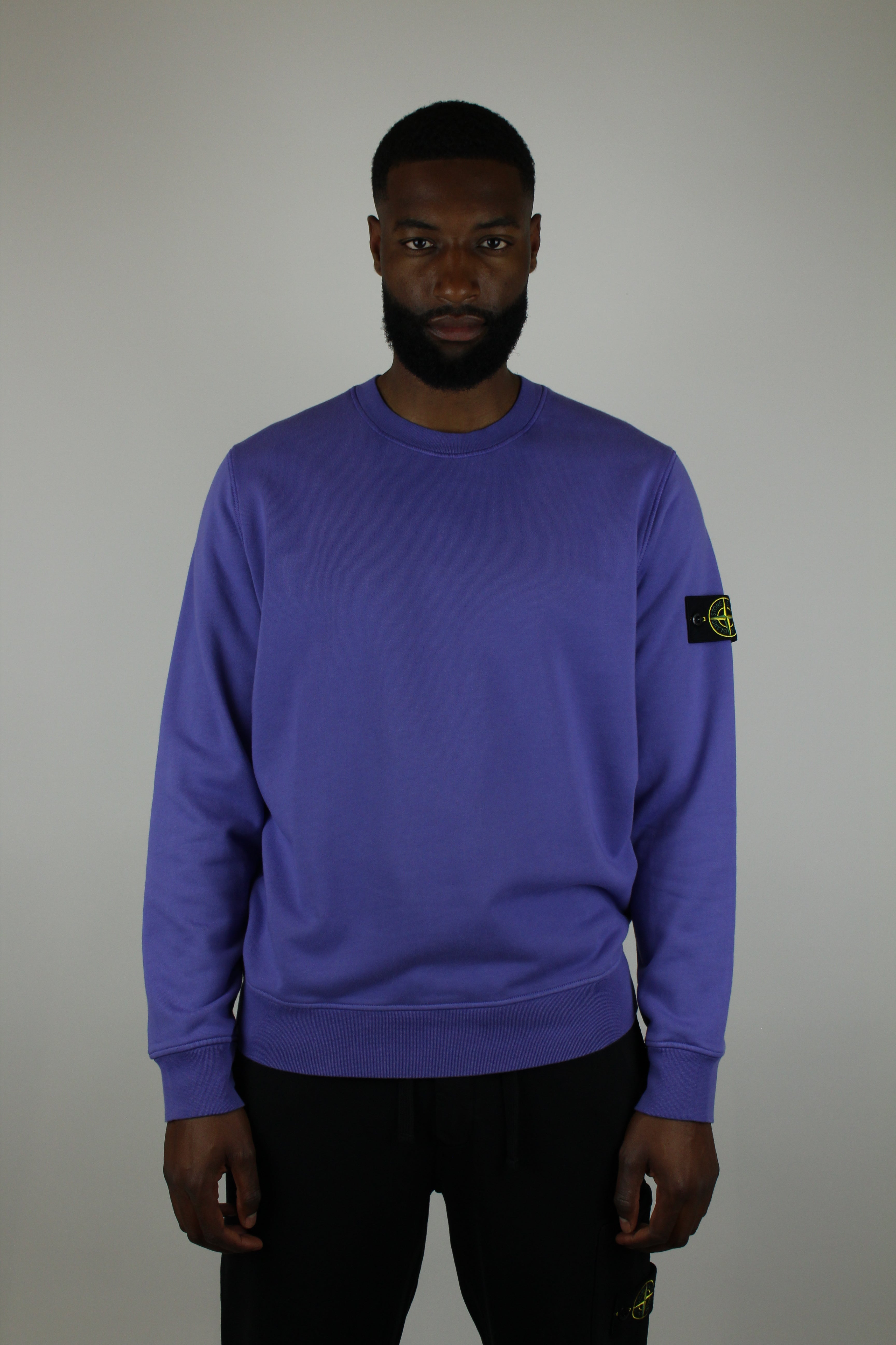 Shop the Stone Island Felpa Crewneck 'Purple' – a premium cotton crewneck with the iconic compass patch, combining comfort, quality, and standout streetwear style.