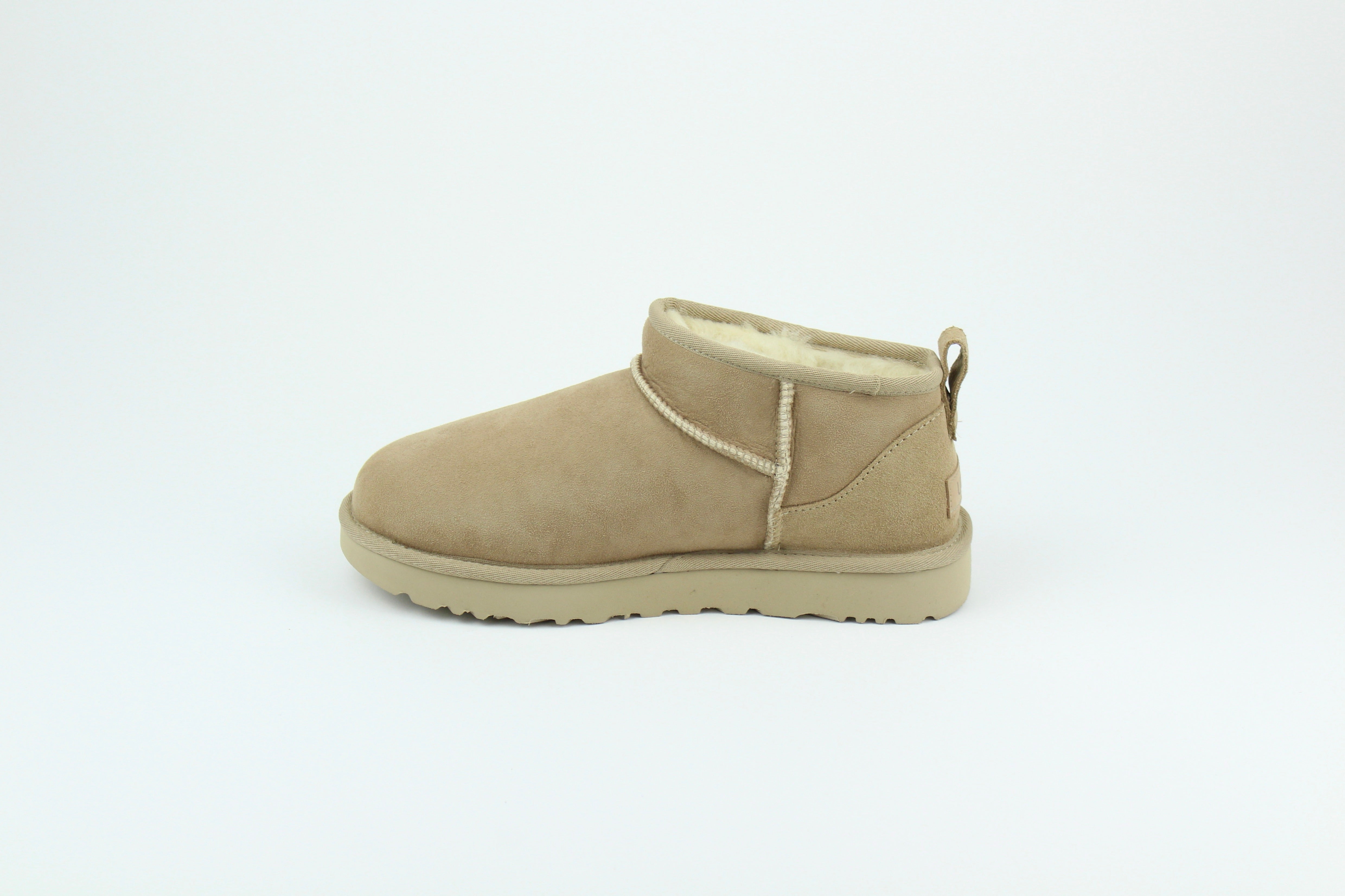 UGG Classic Ultra Mini Sand Women’s – Suede Shearling Ankle Boots, Cozy Winter Footwear, Iconic Comfortable Lifestyle Shoes
