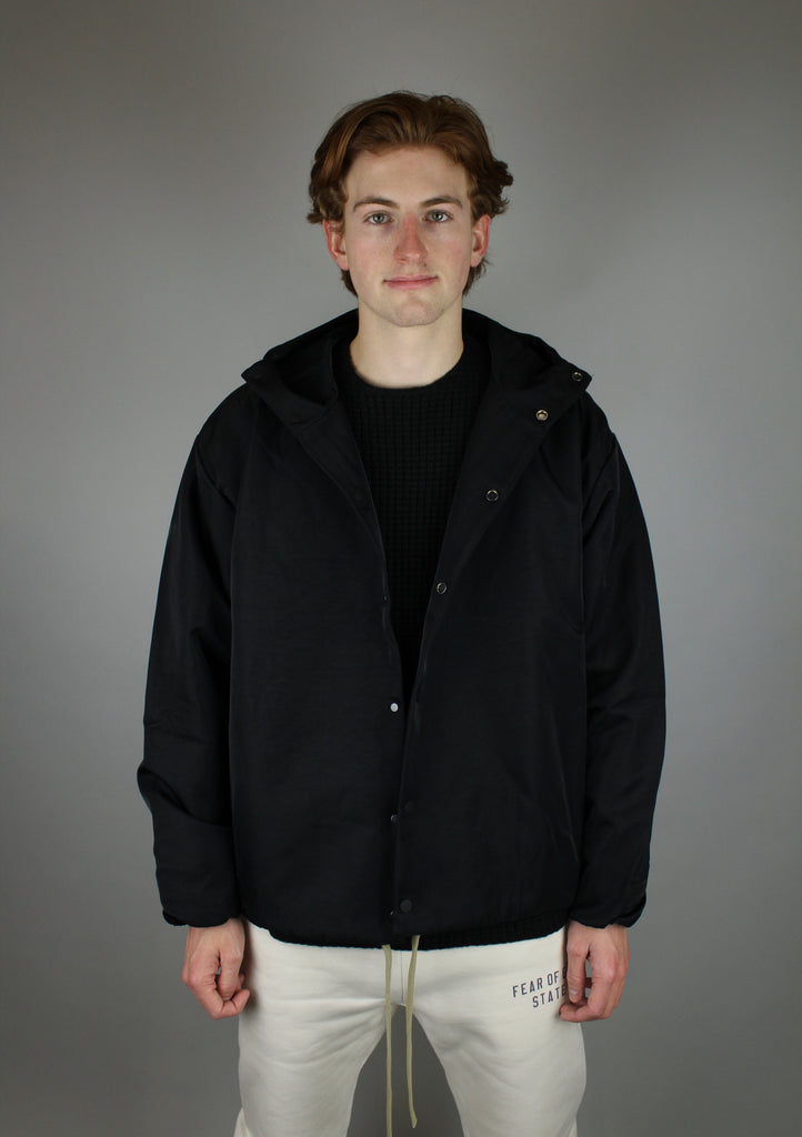 Fear of God Essentials Textured Nylon Hooded Coaches Jacket 'Black'-10040113070410-The Attic