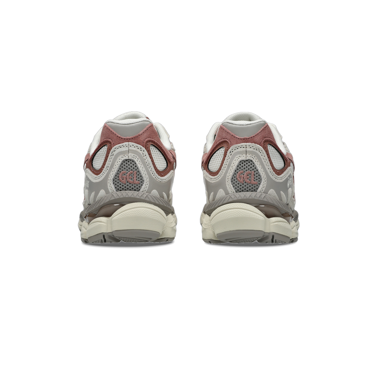 Rear view of a pair of Asics GEL-NYC sneakers in cream, grey, and pink with visible GEL branding on the heel cages and chunky off-white midsoles