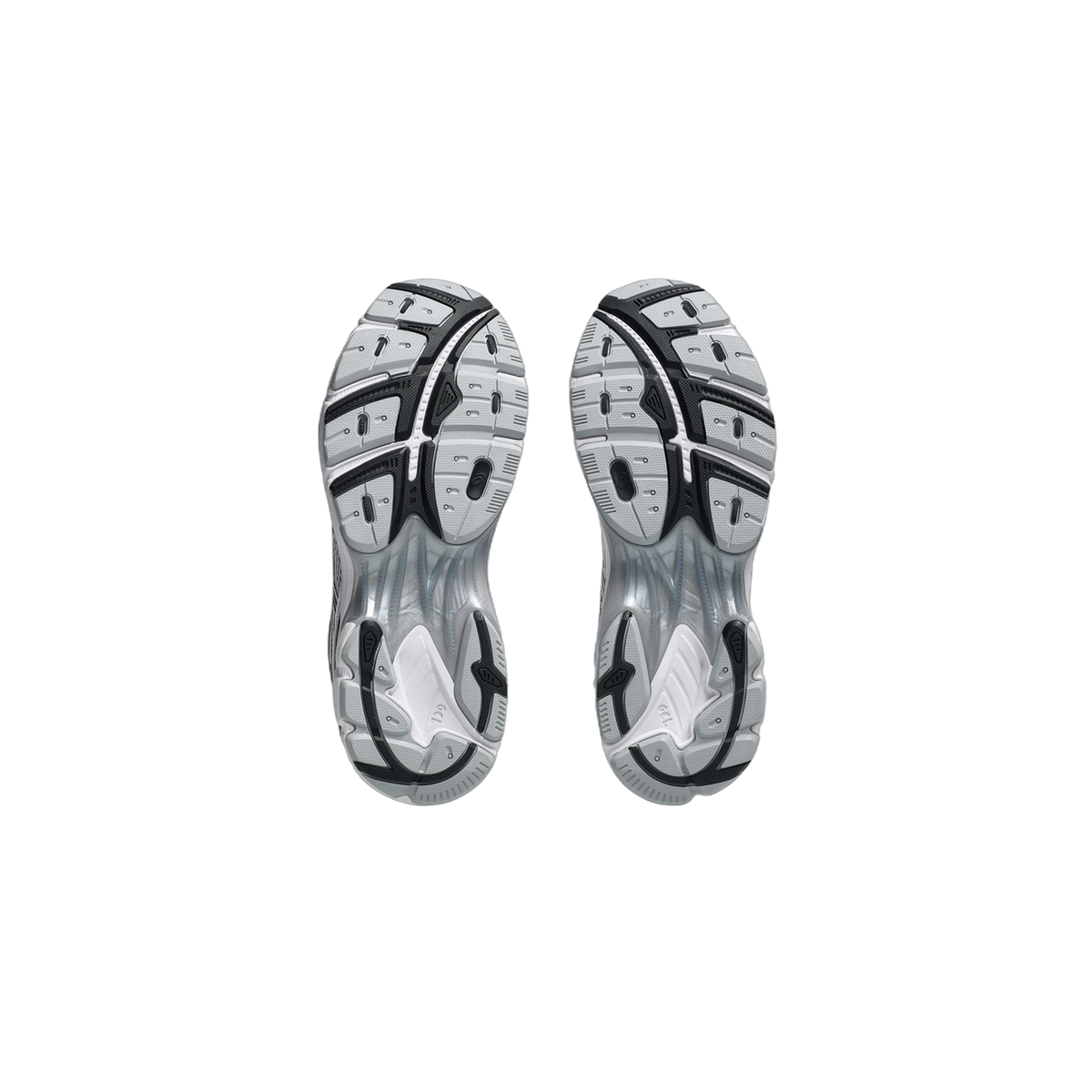 Bottom view of a pair of white and gray Asics GT-2160 sneakers showing the tread pattern on both outsoles