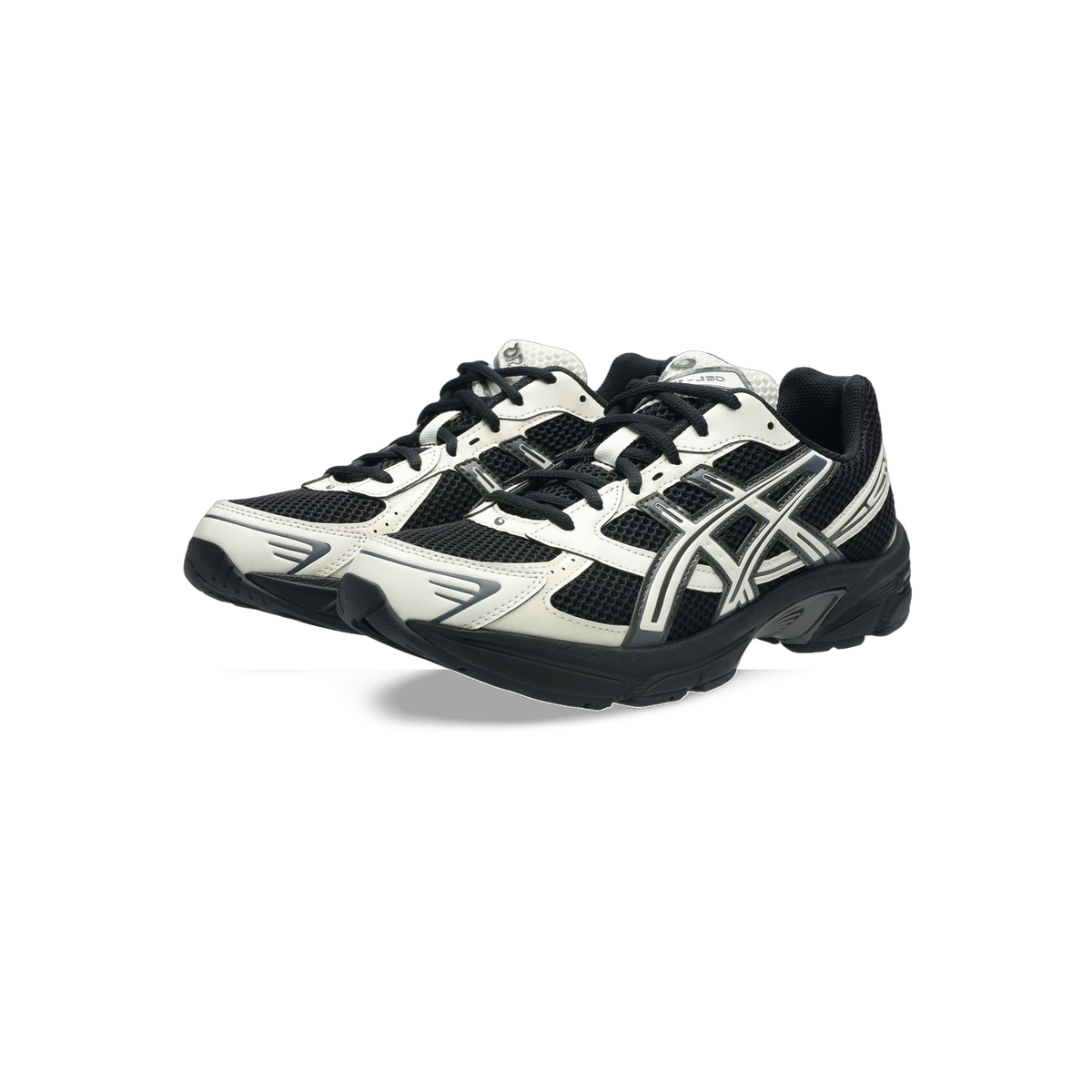 Pair of black and white Asics Gel-1130 sneakers with mesh panels and grey accents shown from a front side angle
