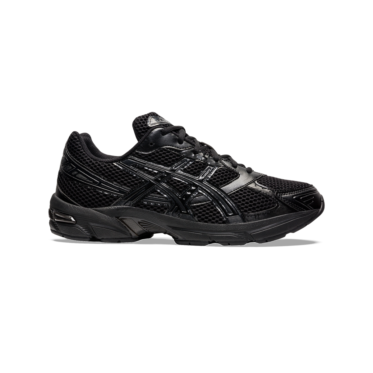 Side view of an all-black Asics Gel-1130 sneaker with mesh upper, patent leather overlays, and a visible gel cushioning unit in the heel.