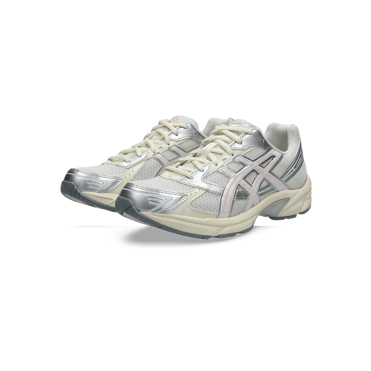 Pair of Asics Gel-1130 sneakers in cream with silver overlays and pale pink accents, shown from a three-quarter angle.