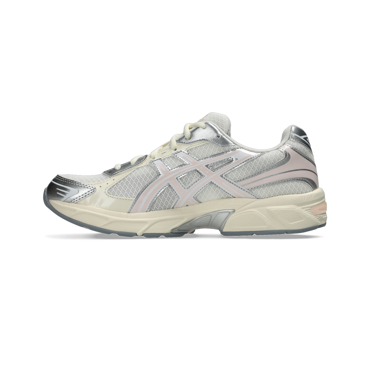 Side view of a cream Asics Gel-1130 running shoe with silver overlays, pink accents, and a cream midsole.