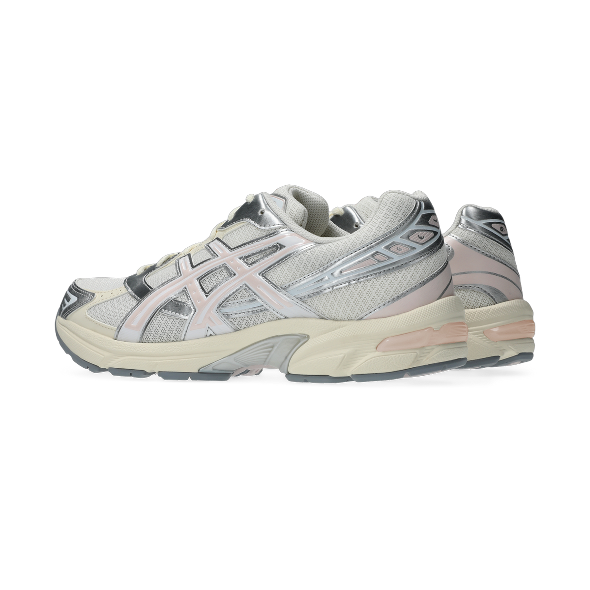 Side view of a pair of white and cream Asics Gel-1130 sneakers with pink and silver accents and a cream midsole.