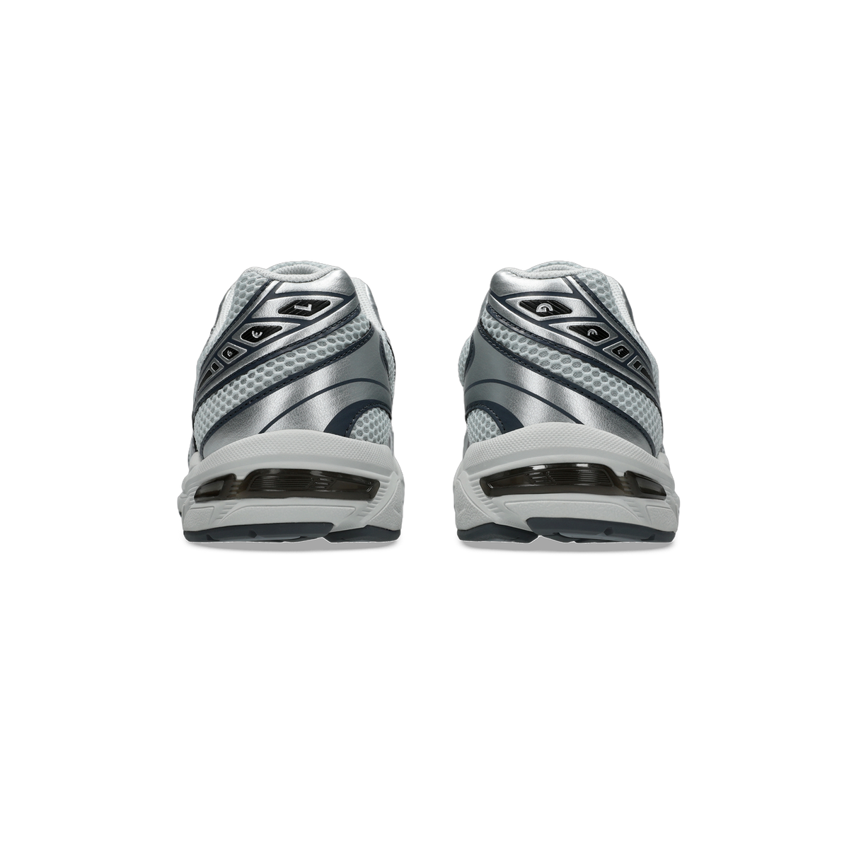 Rear heel view of a pair of gray and silver Asics Gel-1130 sneakers with mesh panels and visible gel cushioning units in the heels