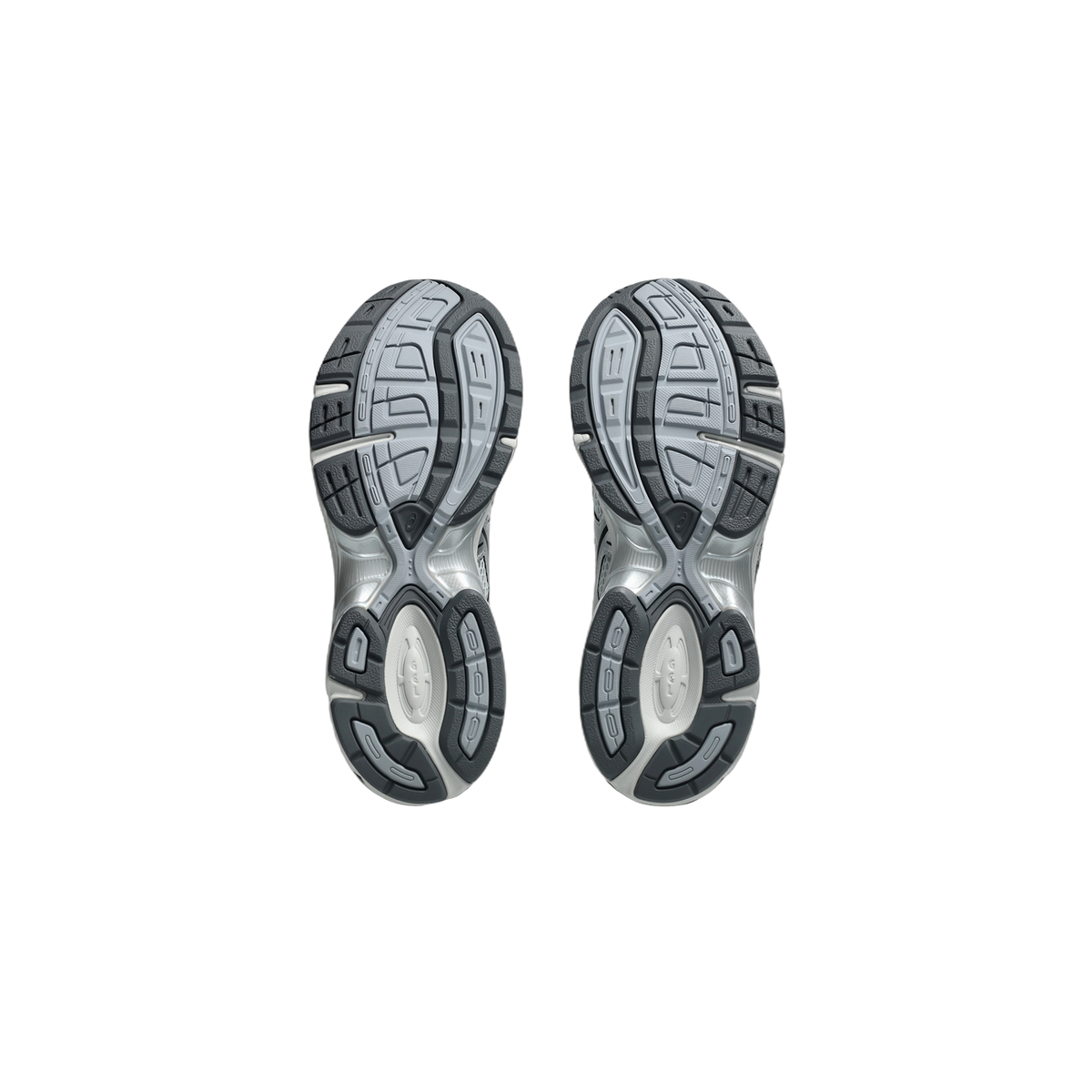 Bottom view of a pair of gray and silver Asics Gel-1130 sneakers showing the tread pattern of both outsoles