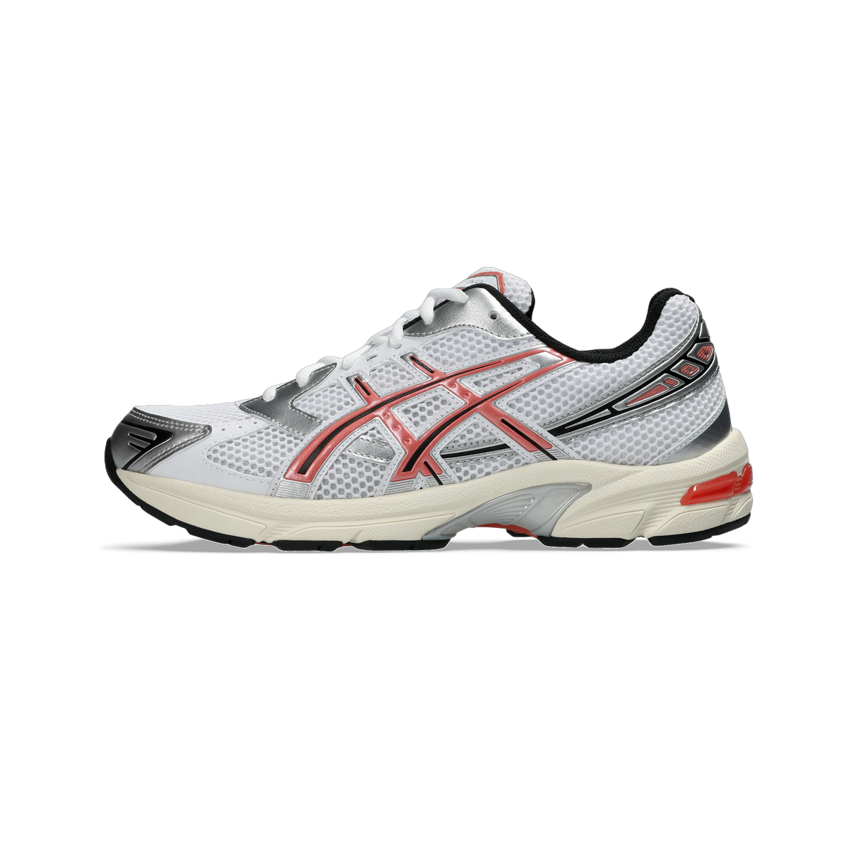 Side view of a white Asics Gel-1130 running shoe with red criss-cross overlays, silver accents, black heel trim, and a cream midsole with red heel pod.