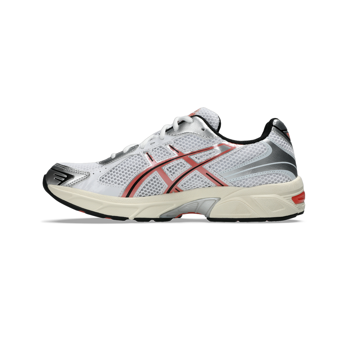 Side view of a white Asics Gel-1130 running shoe with red and silver overlays, black heel trim, and a cream midsole.