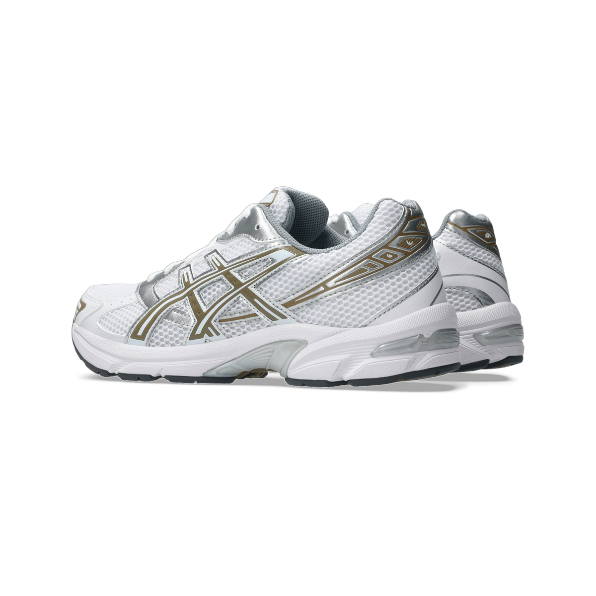 Side view of a white Asics Gel-1130 running shoe with silver and gold overlays and a white midsole with dark gray outsole.