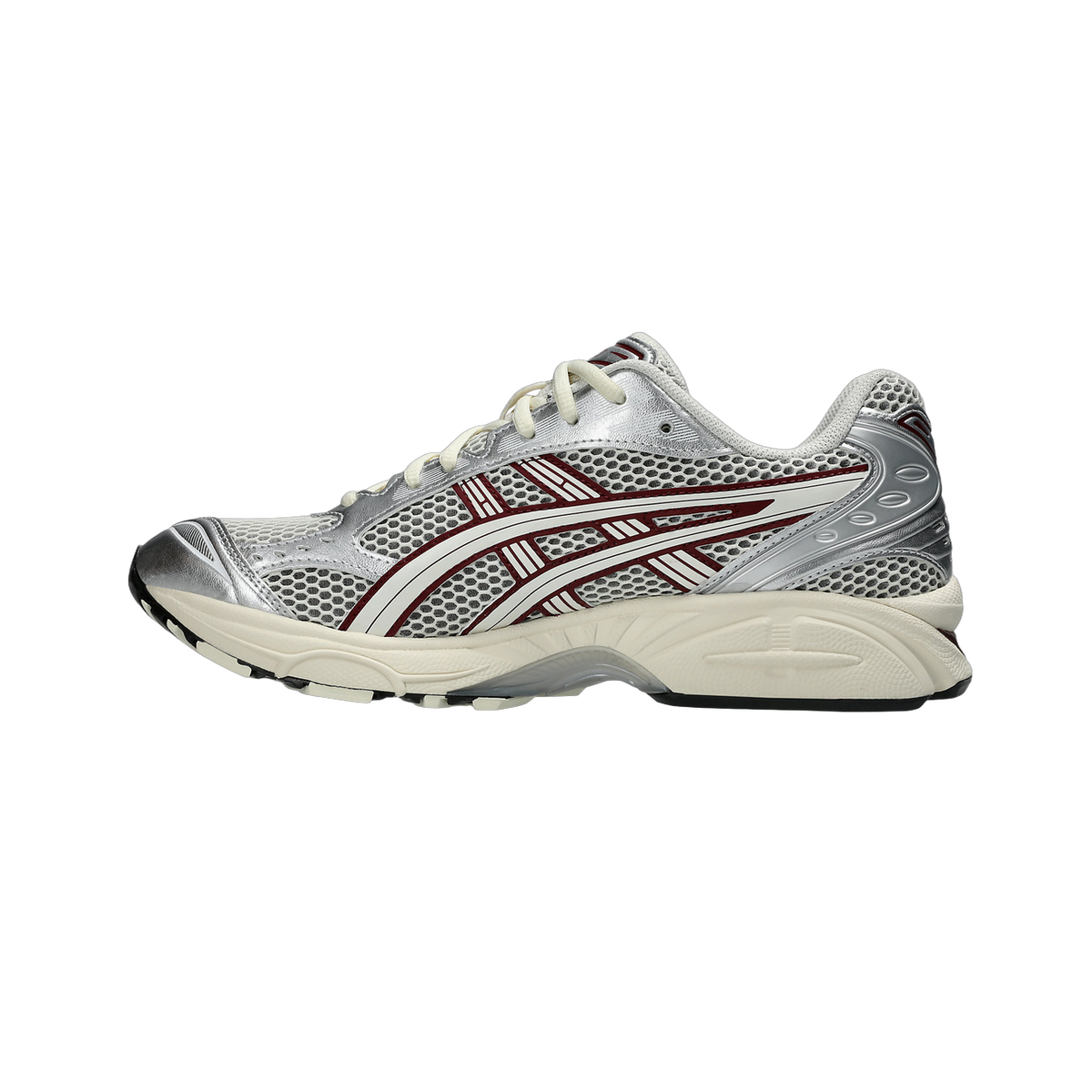 Side view of a silver Asics Gel-Kayano 14 sneaker with burgundy and white overlays, mesh upper, and cream midsole.