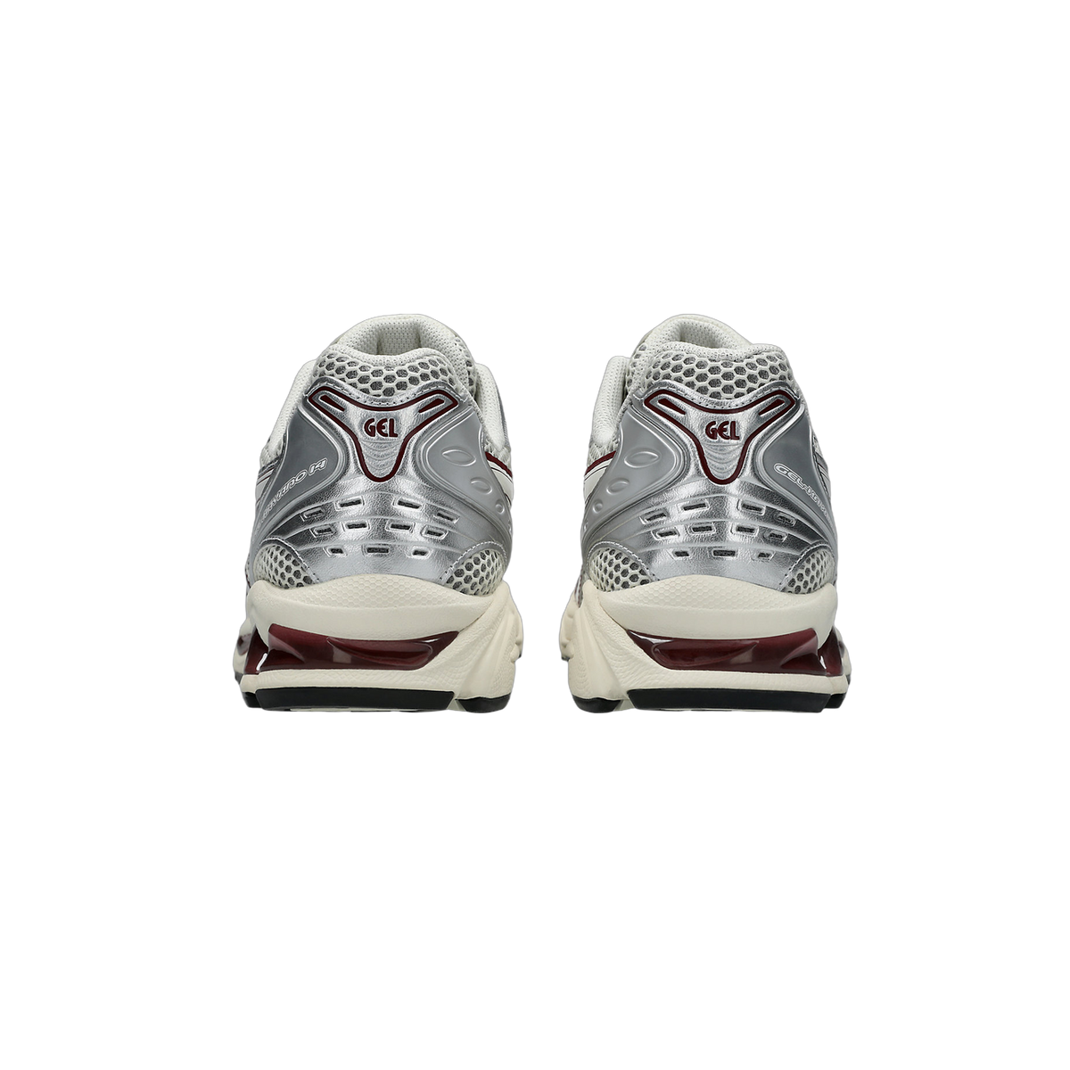 Rear view of a pair of Asics Gel-Kayano 14 sneakers in silver and white with dark maroon accents on the heel and midsole.