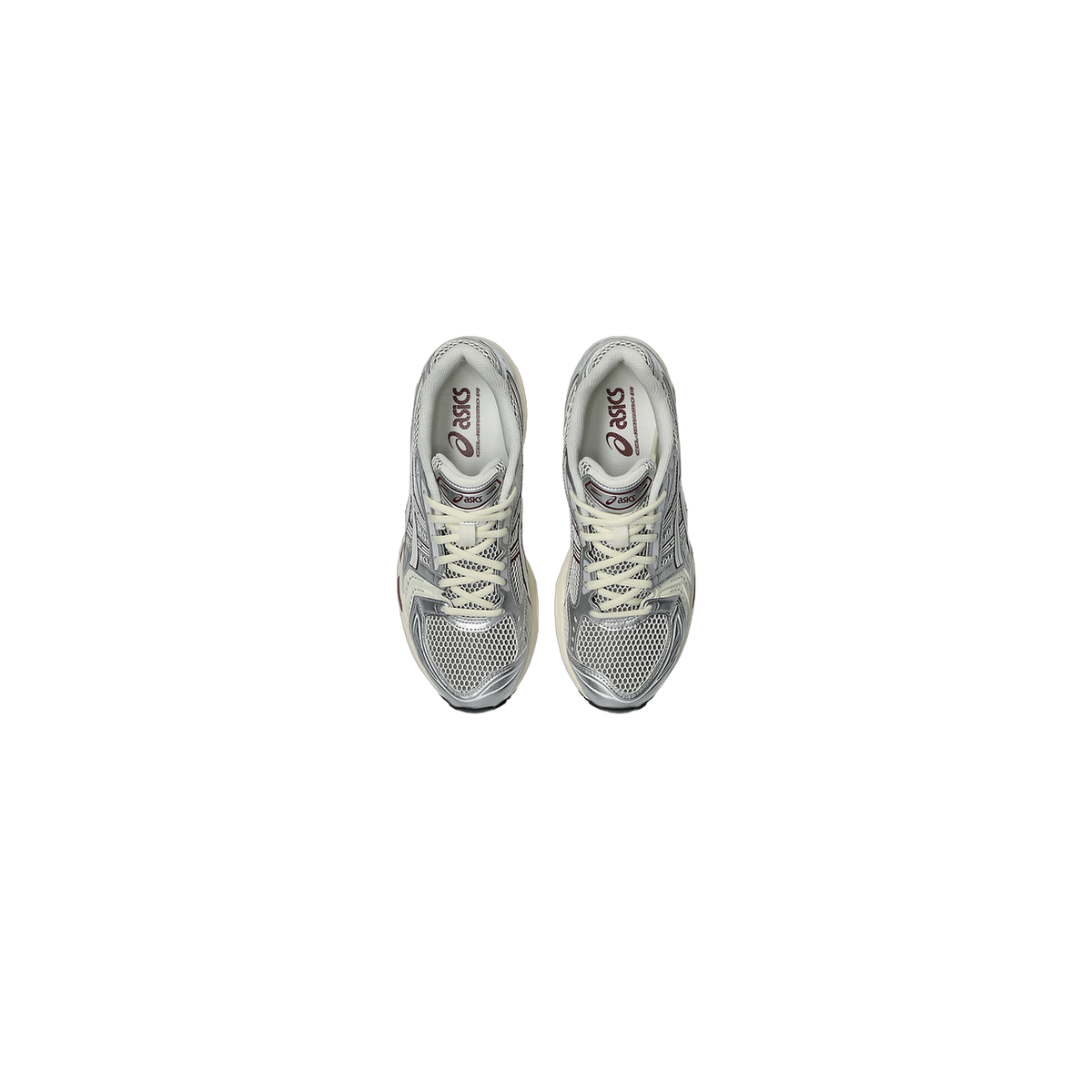 Top-down view of a pair of silver and grey Asics Gel-Kayano 14 sneakers with mesh panels, cream laces, and maroon Asics branding on the tongue and heel.