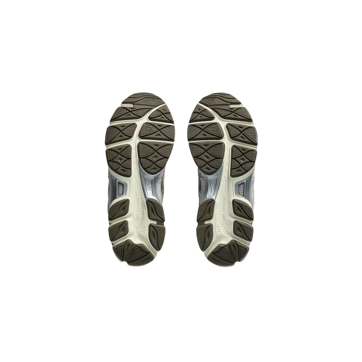 Bottom view of a pair of Asics Gel-NYC sneakers showing brown and cream tread patterns with GEL cushioning and Guidance Line detailing on the outsoles.