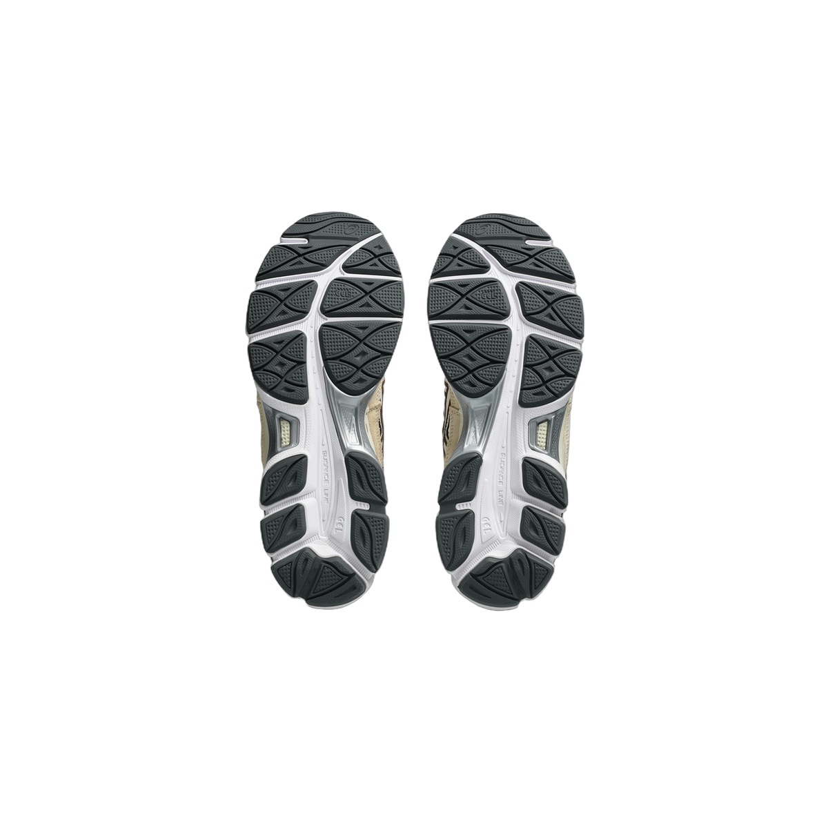 Bottom view of a pair of Asics Gel-NYC sneakers showing white and grey rubber outsoles with a dark grey tread pattern and GEL branding at the heel.