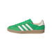 Side view of a green Adidas Gazelle Indoor sneaker with white stripes, mesh textured upper, gum sole, and cream heel tab, toe pointing left.