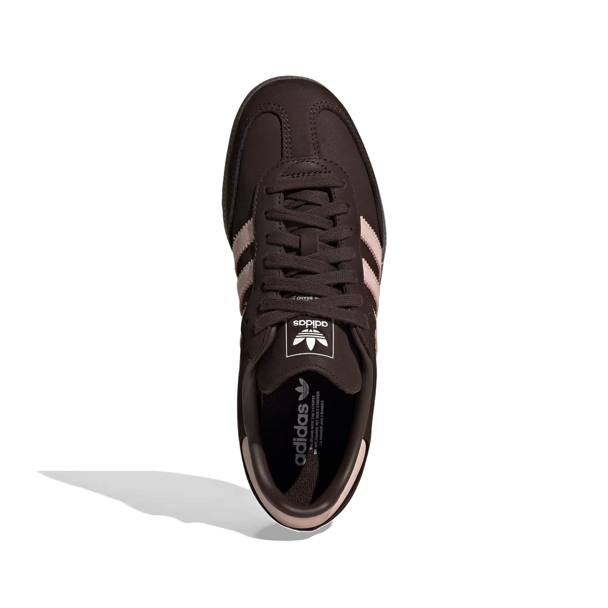 Top-down view of a brown Adidas Samba OG sneaker with pink three stripes, pink heel trim, and white adidas logo on the tongue