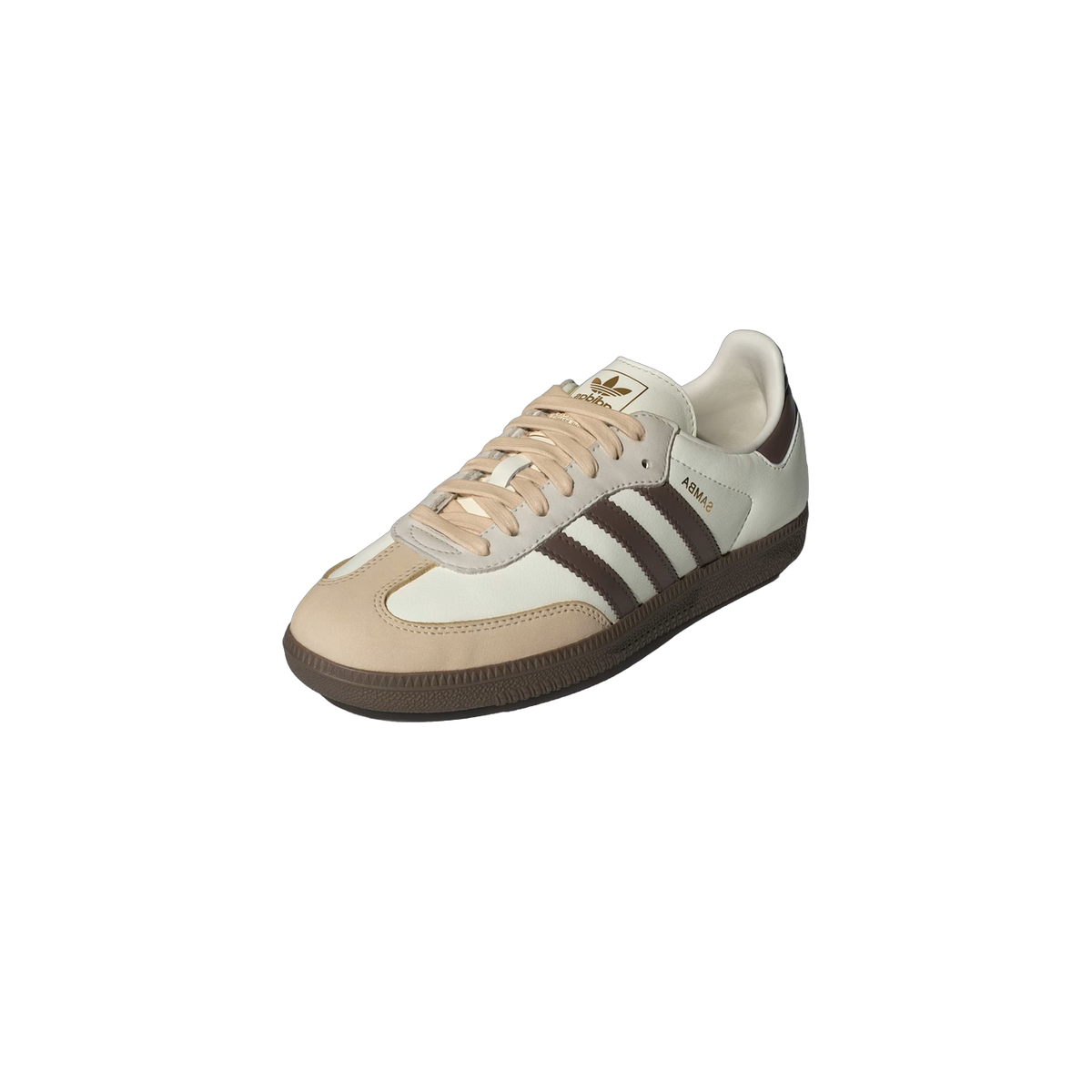 Angled front view of a white Adidas Samba OG sneaker with brown three-stripe detailing, a tan suede toe cap, and gum rubber sole.