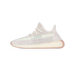 Side view of a cream and grey knit Yeezy Boost 350 V2 sneaker with a mint green side stripe and translucent pink midsole, toe pointing left.