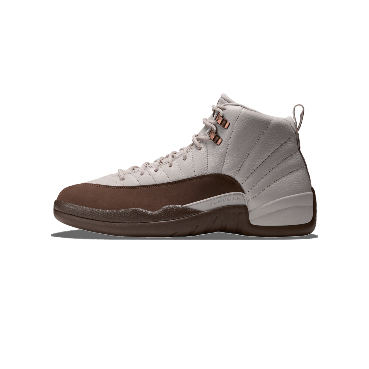 Lateral view of a light grey Air Jordan 12 high-top sneaker with a dark brown toe cap and midsole, bronze eyelets, and Jumpman branding on the side panel, toe pointing left.