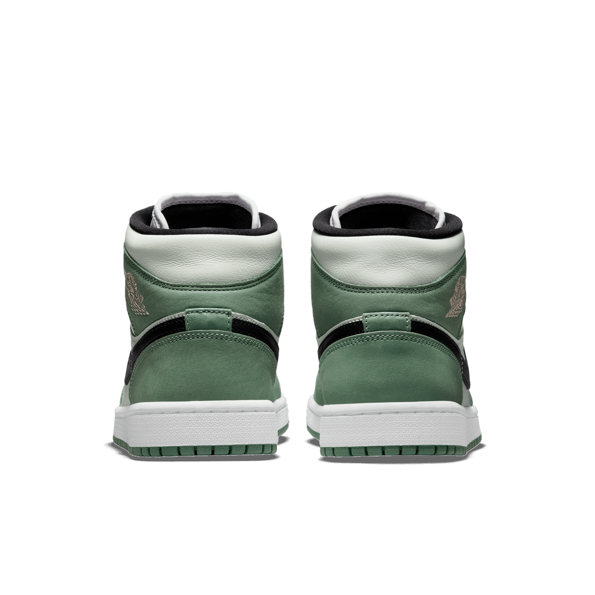 Rear view of a pair of green and white Air Jordan 1 Mid sneakers with black heel tabs and white midsoles on a white background.