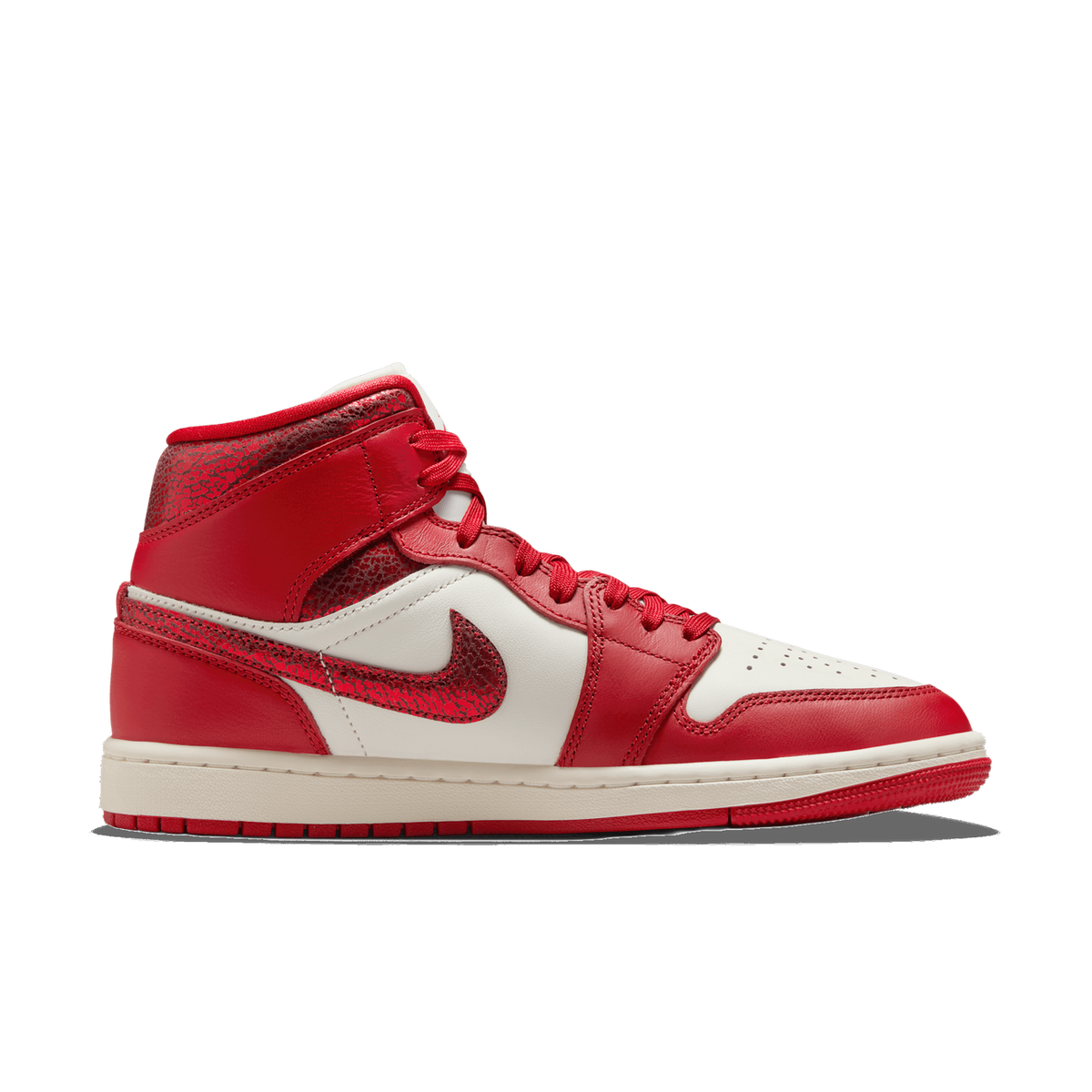 Lateral view of a red and white Air Jordan 1 Mid sneaker with cracked-texture red leather panels and a red crackled swoosh.