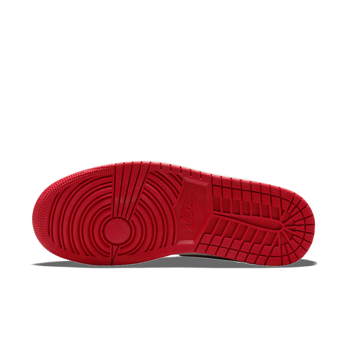 Bottom view of a red Air Jordan 1 Mid sneaker showing the circular tread pattern and Nike logo on the outsole