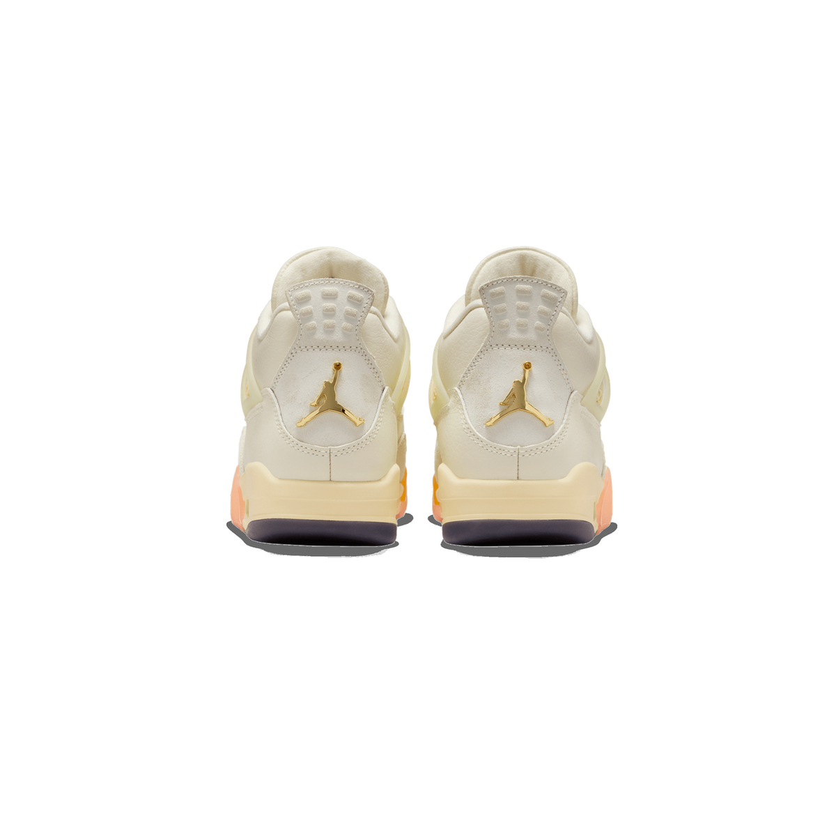 Rear view of a pair of white Air Jordan 4 sneakers with gold Jumpman logos, orange midsole accents, and a dark brown outsole.