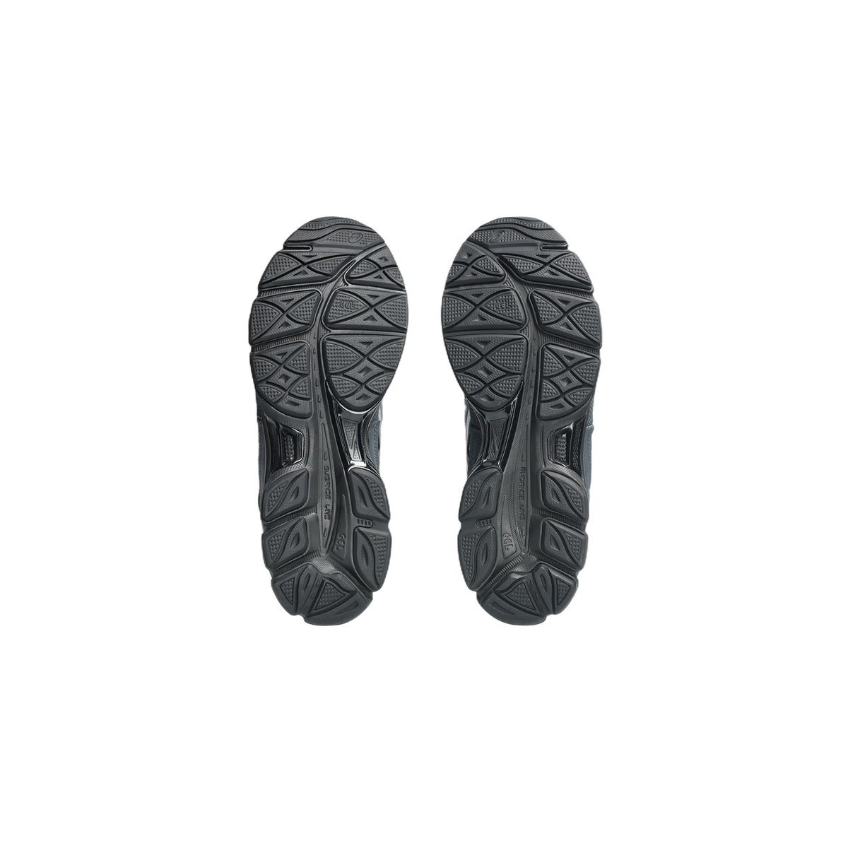 Bottom view of a pair of gray and black Asics Gel-NYC sneakers showing the tread pattern on both outsoles
