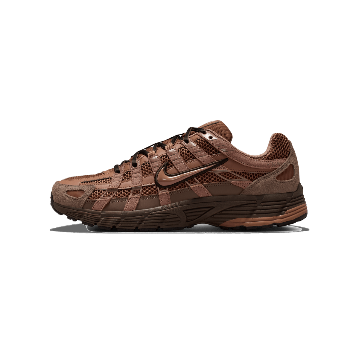 Side profile of a brown Nike P-6000 sneaker with a toe pointing left, showing mesh and suede panels, a glossy Swoosh logo on the side, black laces, and a textured brown rubber sole.