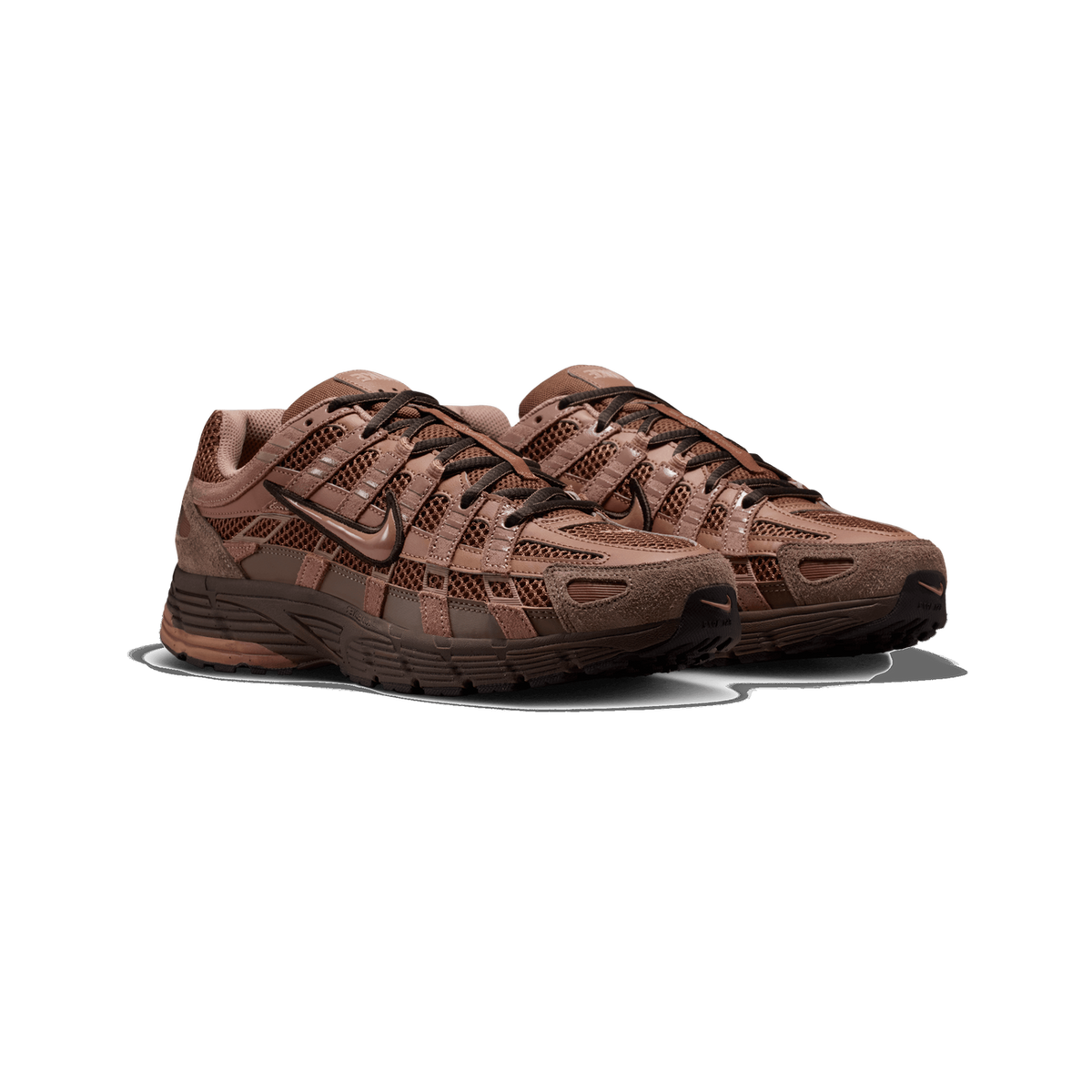Front three-quarter view of a pair of brown Nike P-6000 sneakers set side by side on a white background, showing mesh and suede panels, a patent-finish Swoosh logo, and dark laces.