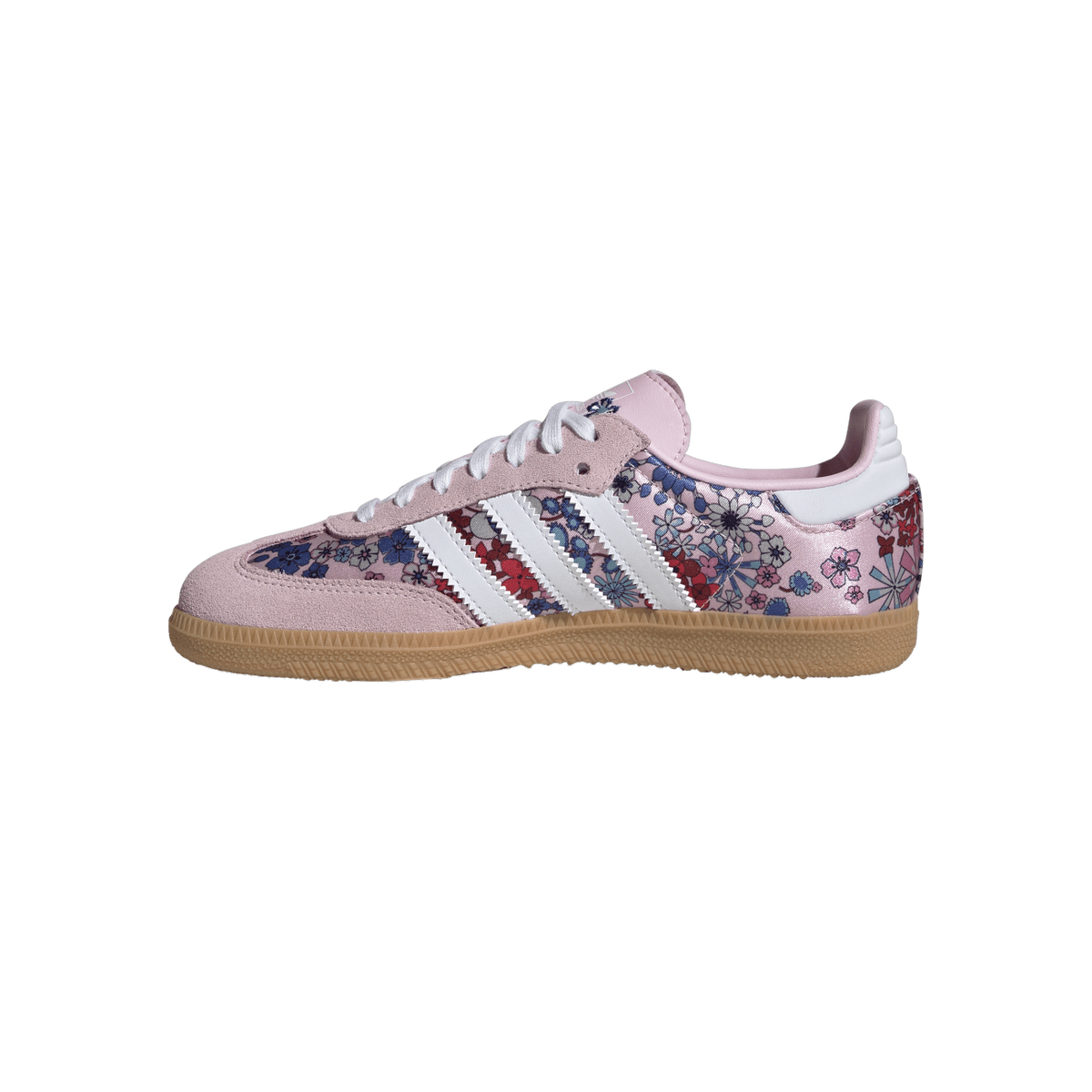 Side view of a pink Adidas Samba sneaker with floral print panels, white stripes, pink suede toe and heel, and a gum sole.