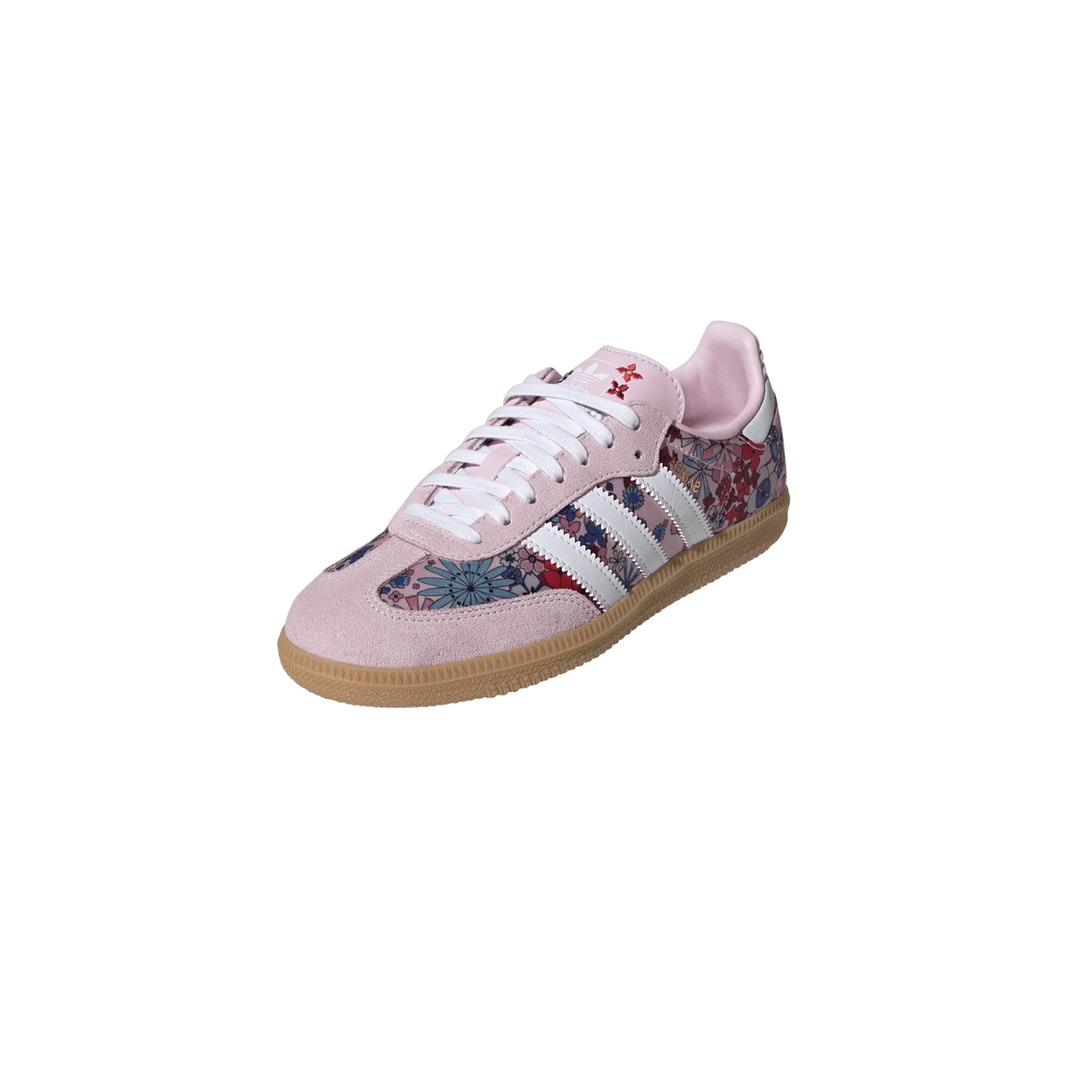 Angled front view of a pink Adidas Samba sneaker with floral print panels, white stripes, and gum sole