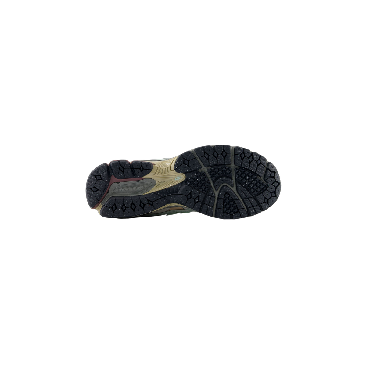 Bottom view of a New Balance sneaker showing a lugged black outsole with tan and maroon accents and the New Balance logo molded into the heel area
