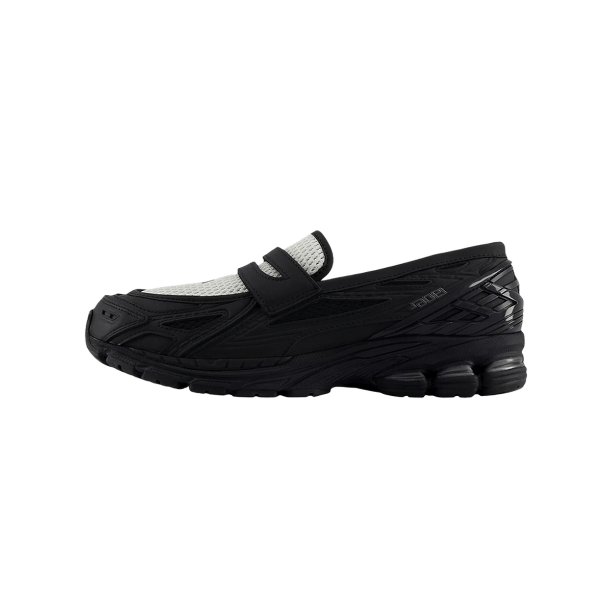Side view of a black New Balance 1906L sneaker with a gray mesh strap closure and segmented black outsole, toe pointing left.