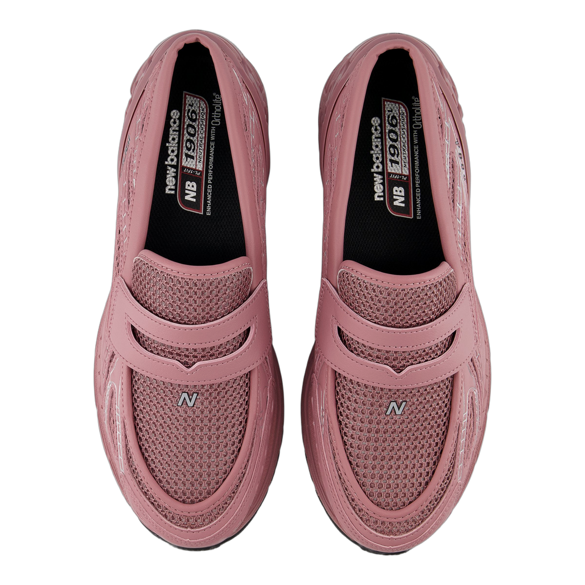Top-down view of a pair of pink New Balance 1906L sneakers with mesh panels, velcro straps, and black insoles printed with New Balance 1906 branding.
