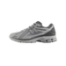 Side view of a gray New Balance 1906R sneaker with toe pointing left, showing the N logo and chunky white and gray midsole.