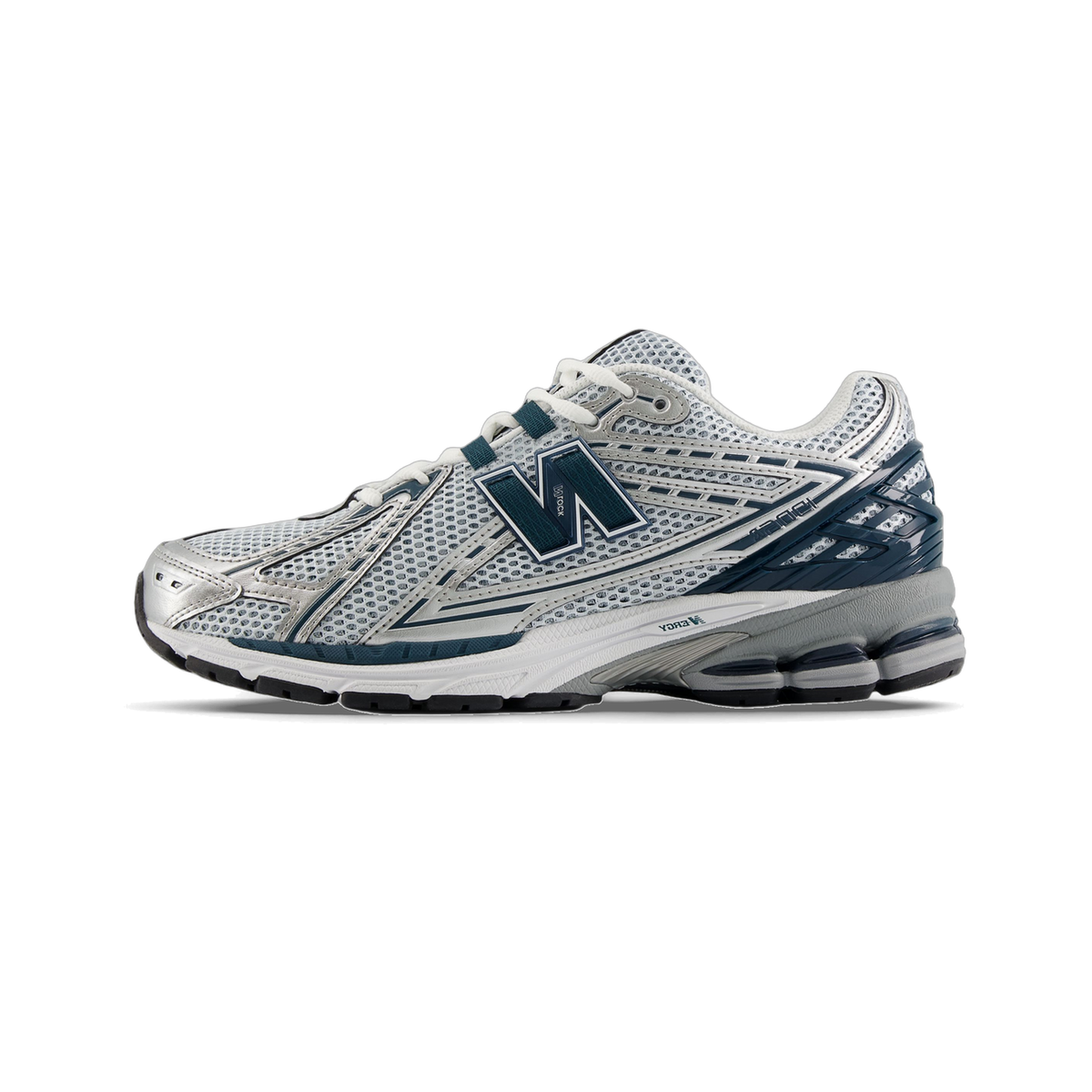 Side view of a New Balance 1906R running shoe in silver and white mesh with deep blue accents and an N-lock overlay, toe pointing left.