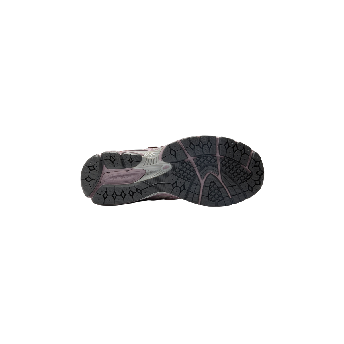 Bottom view of a New Balance 1906W sneaker showing the dark grey tread pattern with mauve accents and New Balance branding on the outsole