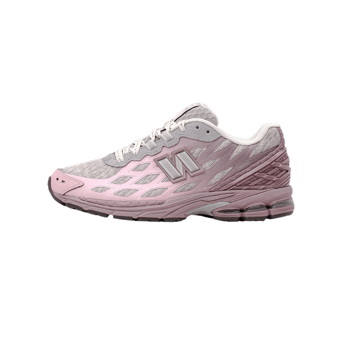 Side view of a pink and grey New Balance 1906W sneaker with diamond mesh overlays and the N logo, toe pointing left.