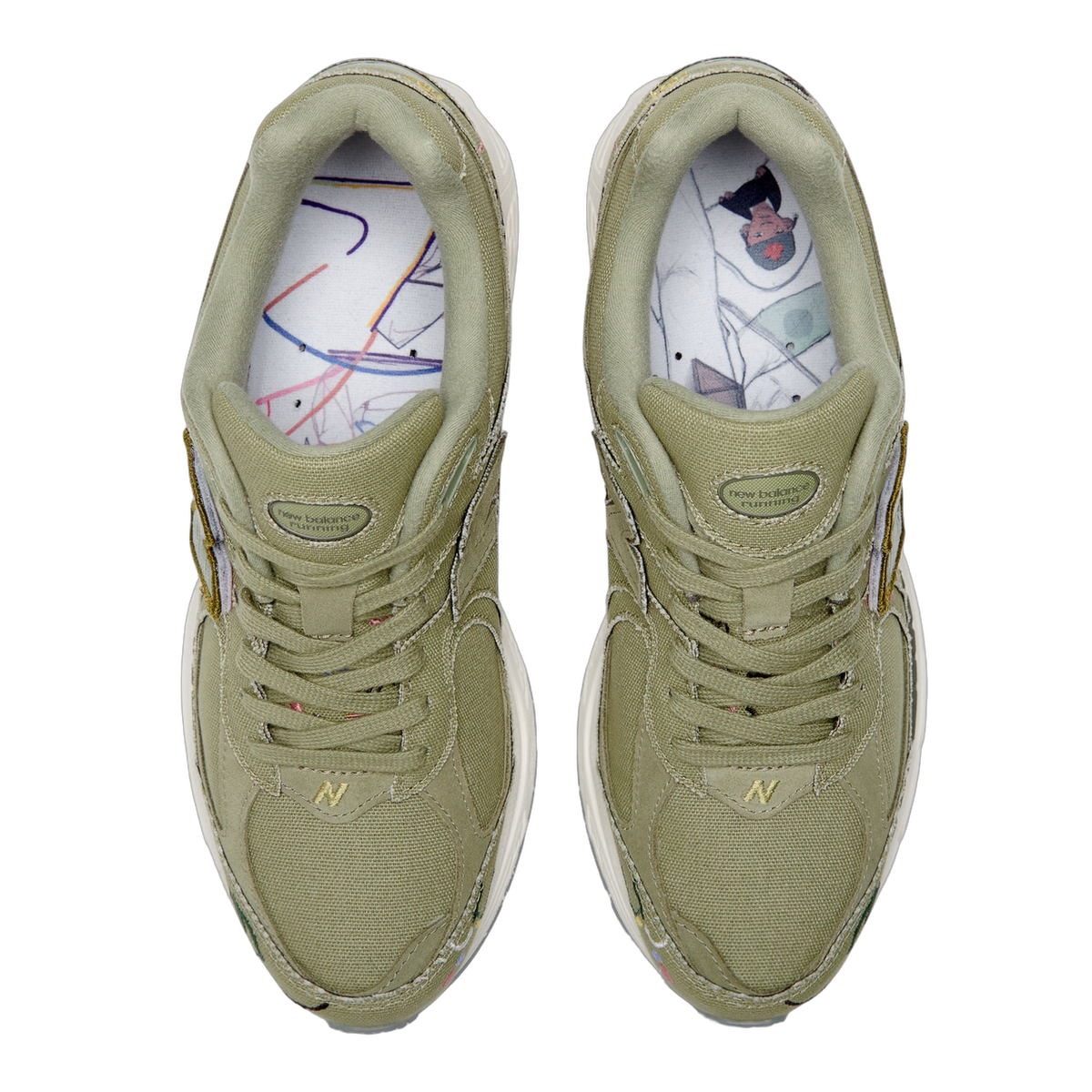 Top-down view of a pair of olive green New Balance 2002R sneakers with illustrated graphic insoles visible inside each shoe.