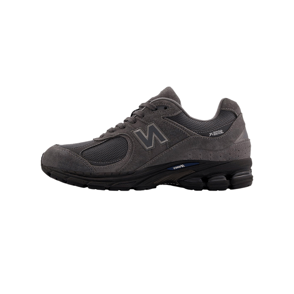 Side view of a gray New Balance 2002R sneaker with black midsole, blue accent stripe, and suede and mesh upper, toe pointing left showing the N logo.